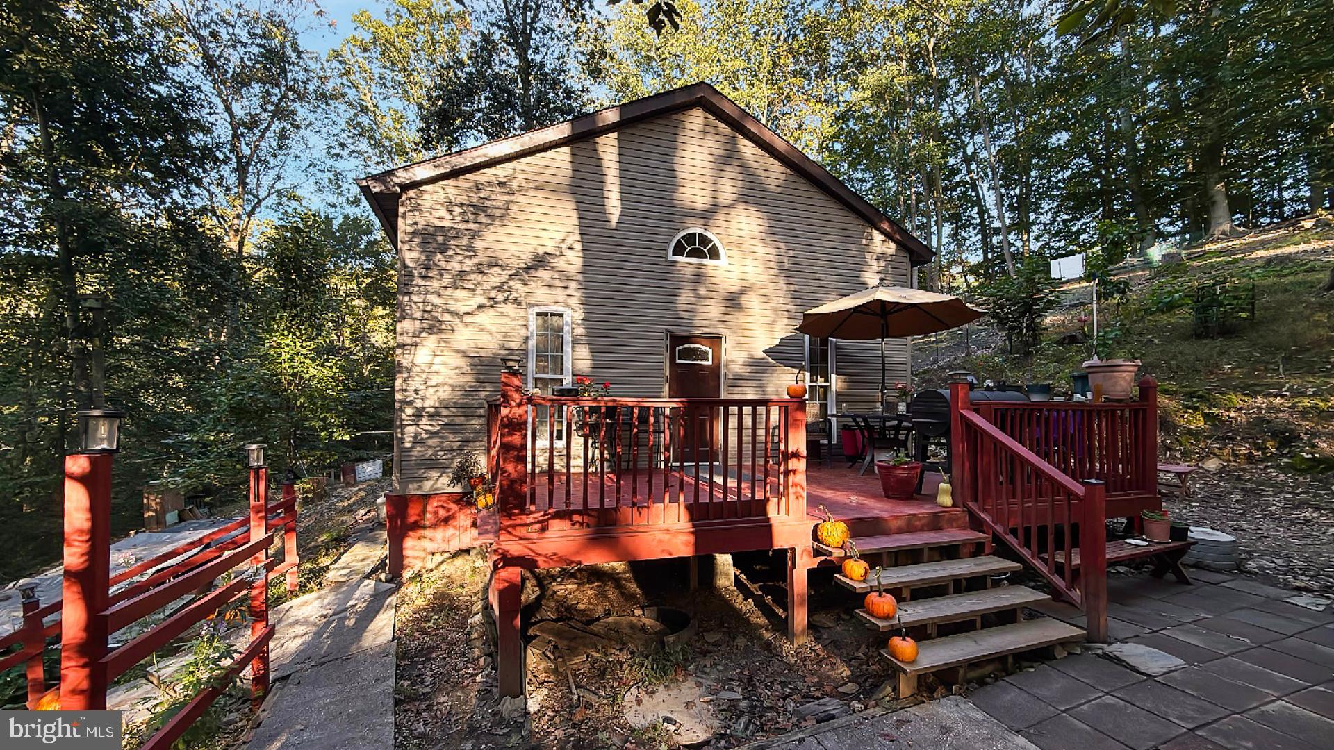 117 Grove Road Delta, PA 17314 - Photo 1 of 23 Charming retreat nestled in nature's embrace.