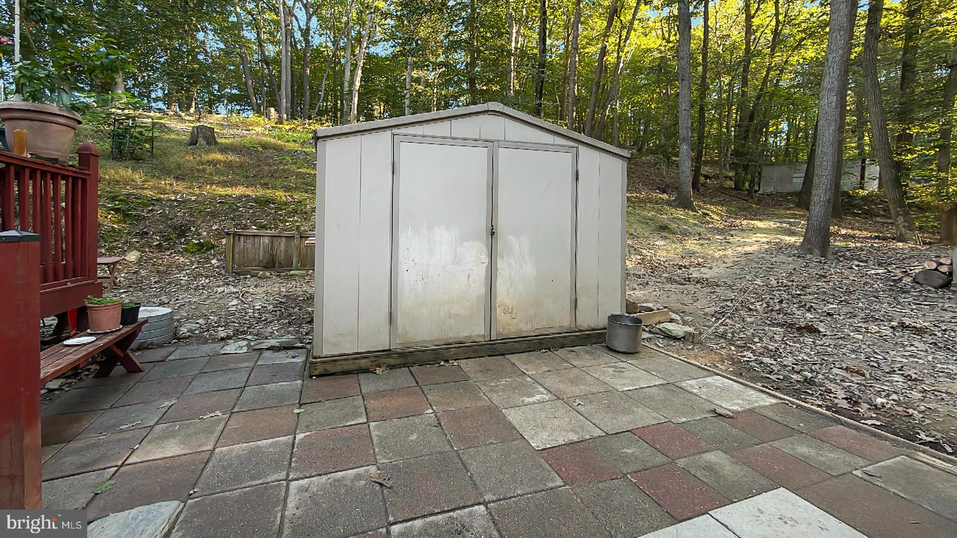 117 Grove Road Delta, PA 17314 - Photo 19 of 23 Serene backyard with a rustic shed.