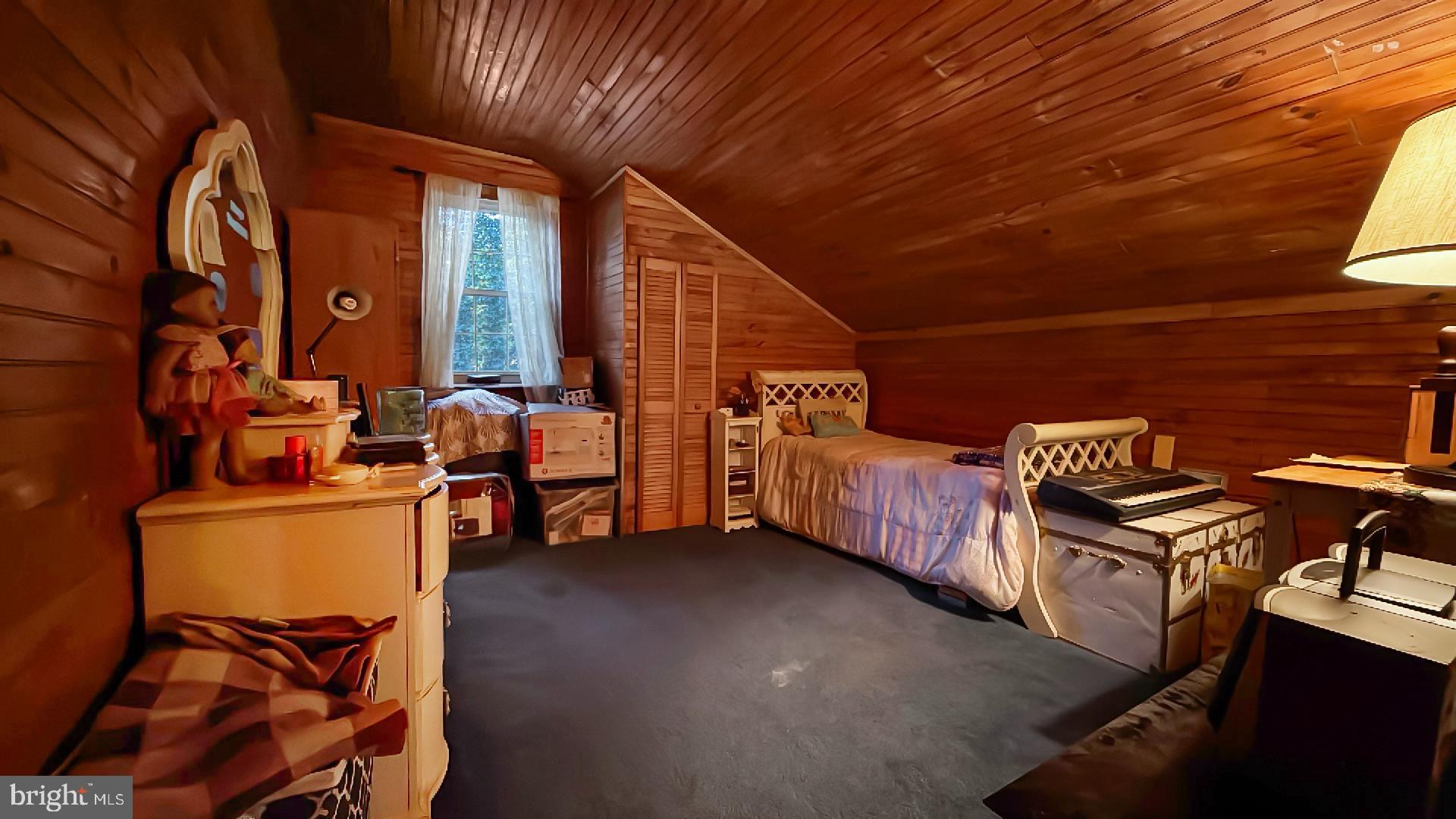 117 Grove Road Delta, PA 17314 - Photo 10 of 23 Cozy attic retreat with warm wooden accents.