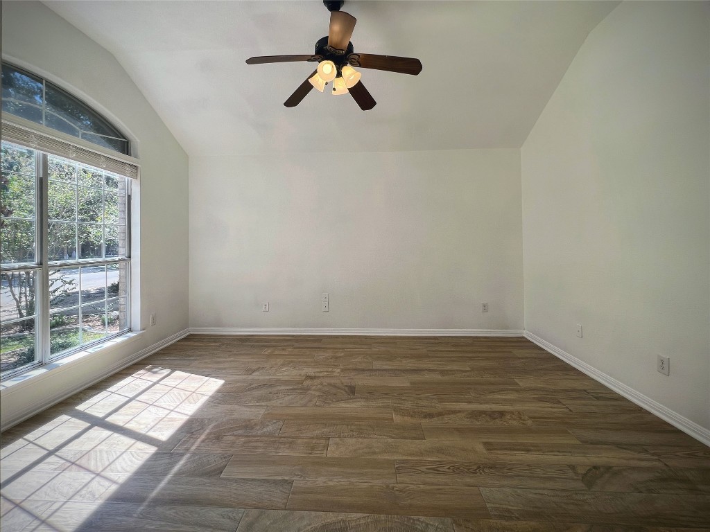 3724 Cheyenne Street Round Rock, TX 78665 - Photo 2 of 4 a view of empty room with wooden floor and fan