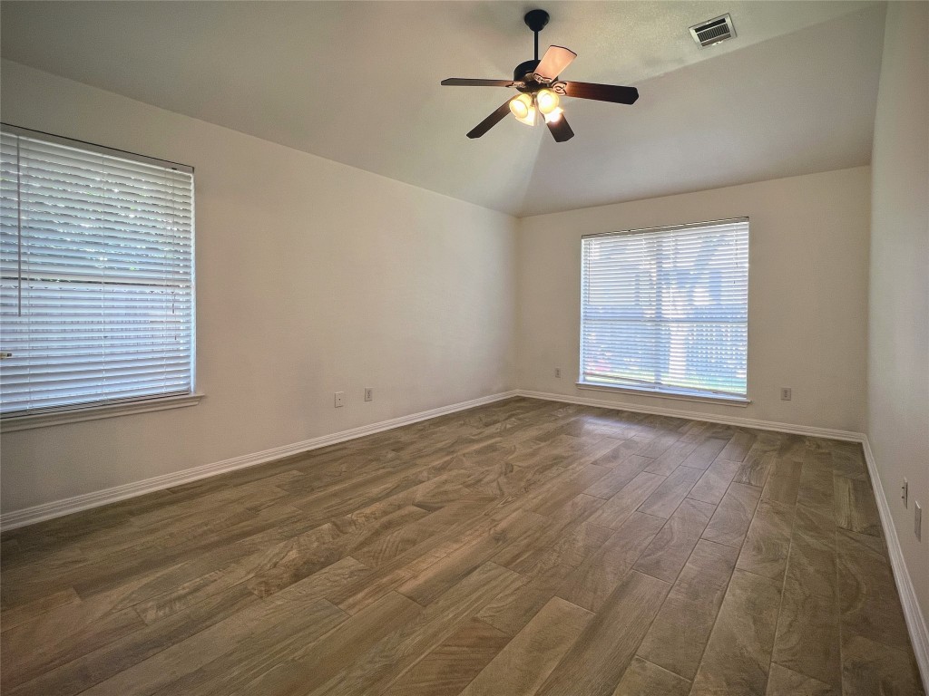3724 Cheyenne Street Round Rock, TX 78665 - Photo 3 of 4 a view of empty room with wooden floor and fan