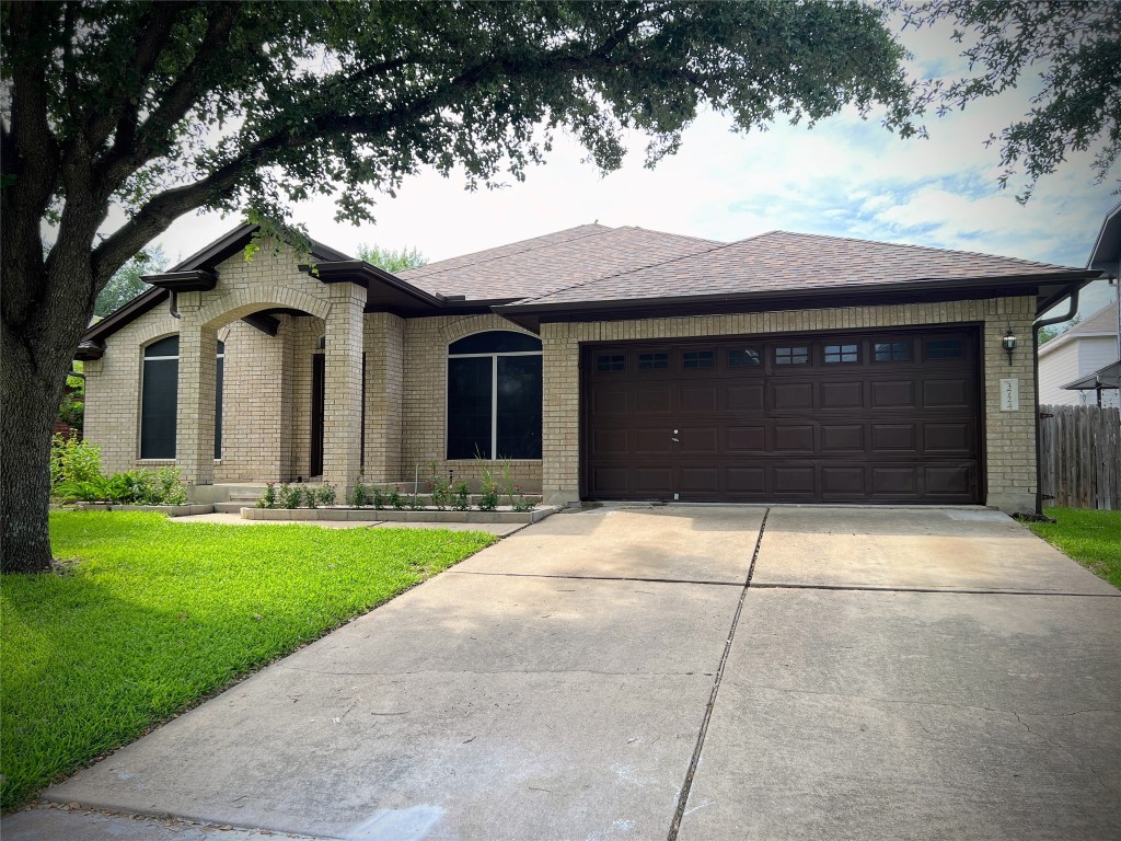 3724 Cheyenne Street Round Rock, TX 78665 - Photo 4 of 4 a house view with a garden space