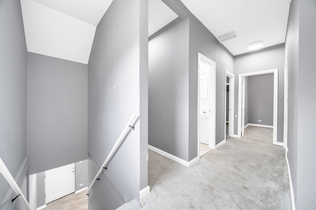 69 East 159th Street Harvey, IL 60426 - Photo 13 of 25 a view of a hallway with staircase