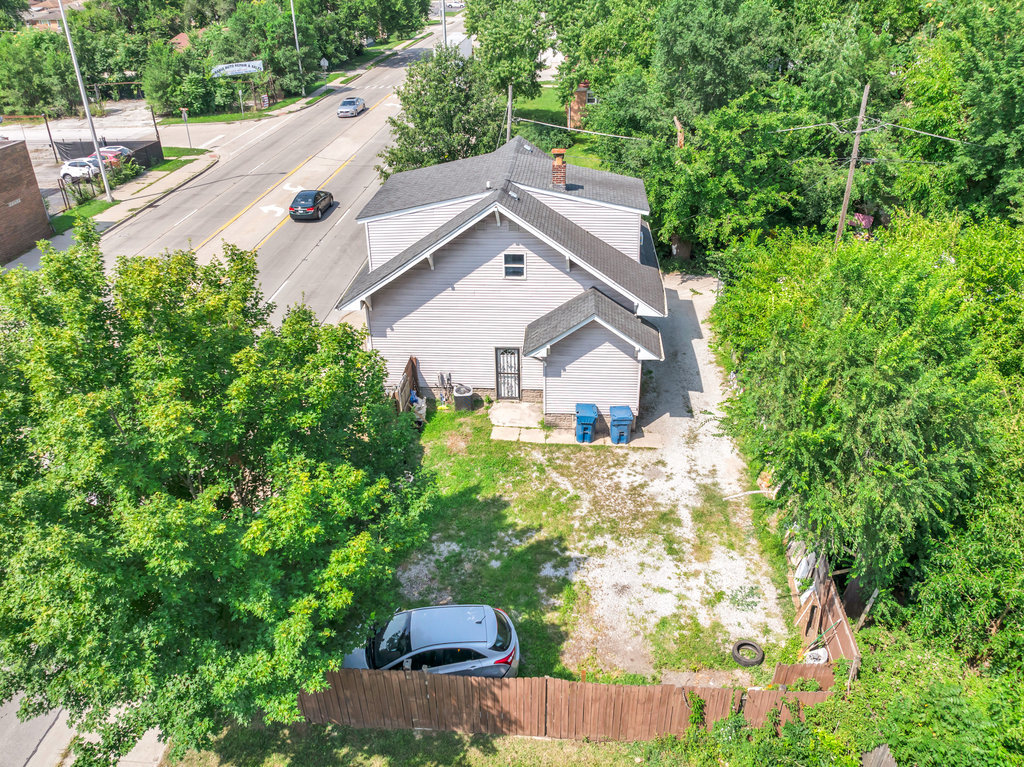 69 East 159th Street Harvey, IL 60426 - Photo 17 of 25 a view of a house with a yard and plants
