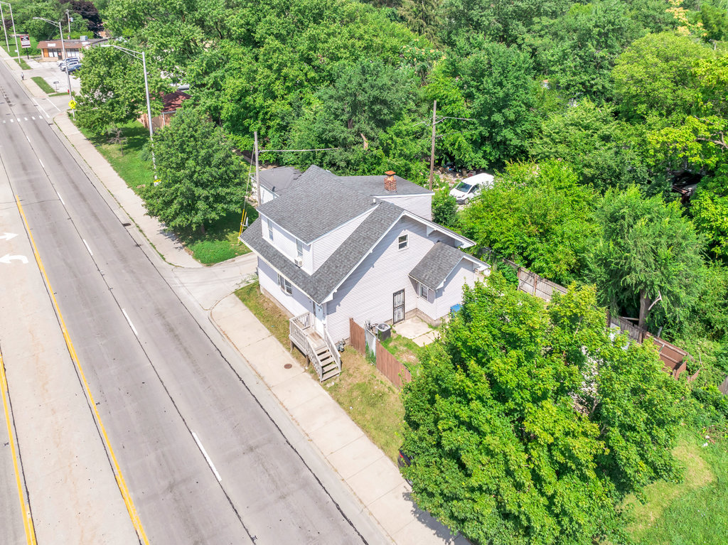 69 East 159th Street Harvey, IL 60426 - Photo 19 of 25 a view of a house with a yard