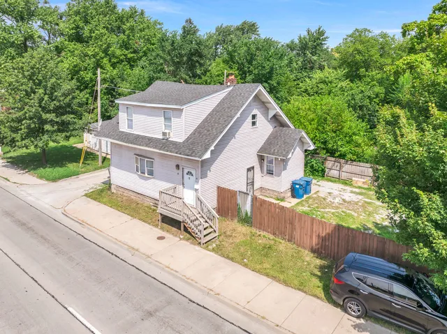 a aerial view of a house with a yard