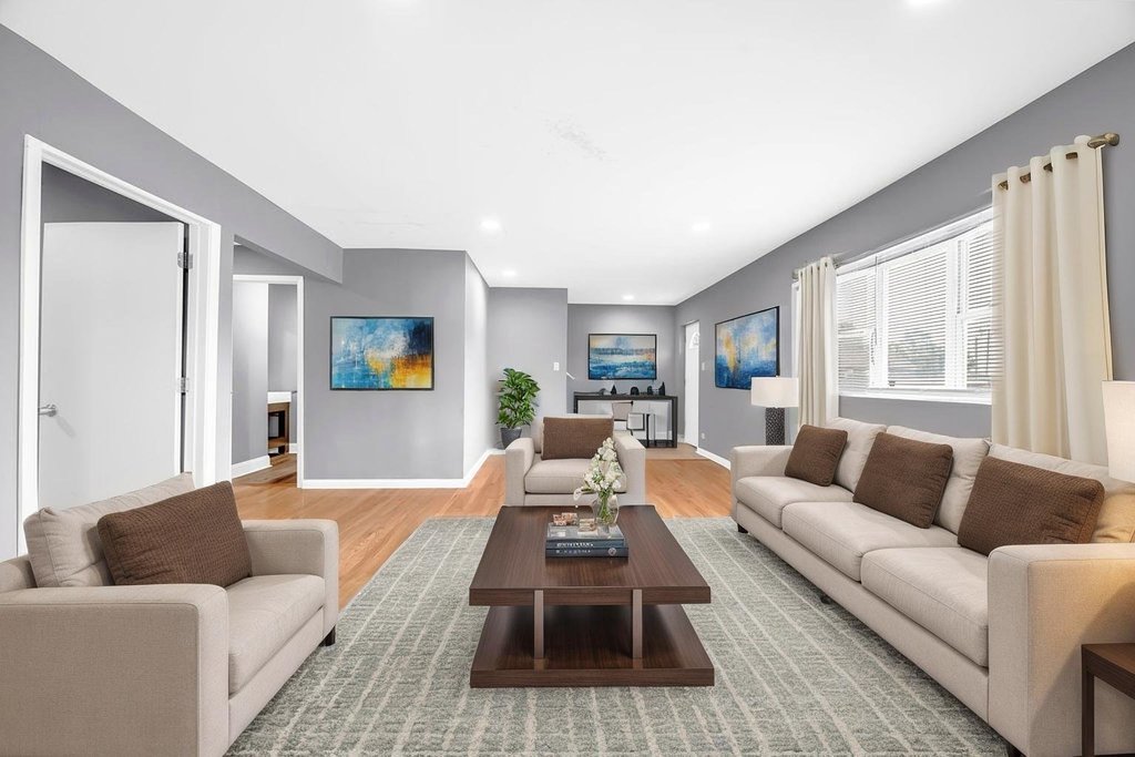 69 East 159th Street Harvey, IL 60426 - Photo 2 of 25 a living room with furniture and a large window