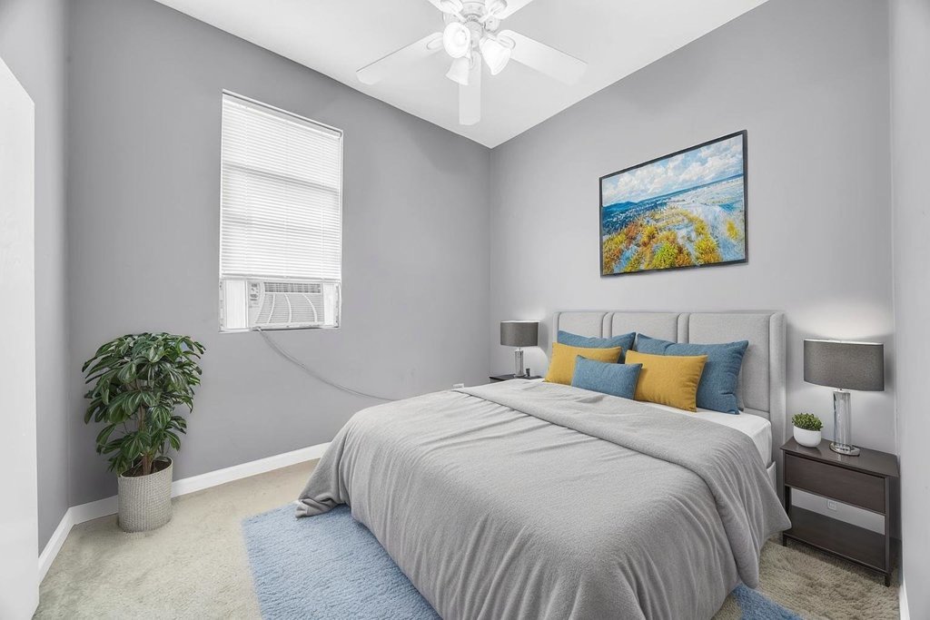 69 East 159th Street Harvey, IL 60426 - Photo 6 of 25 a bedroom with bed and window