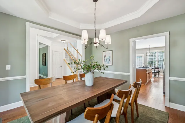 a kitchen with stainless steel appliances granite countertop a stove refrigerator sink and cabinets