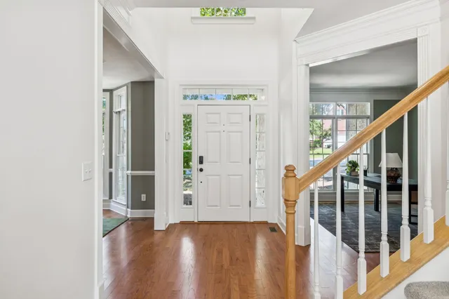 a living room with furniture fireplace and window