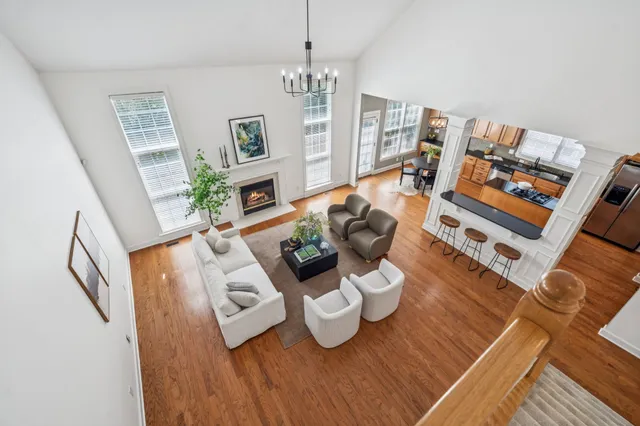 a living room with furniture a fireplace and a table