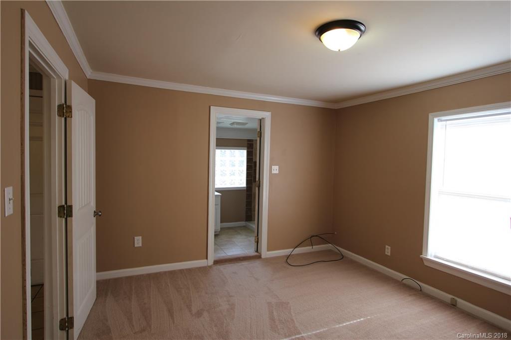6616 Charlie Walker Road Kannapolis, NC 28081 - Photo 12 of 16 an empty room with windows