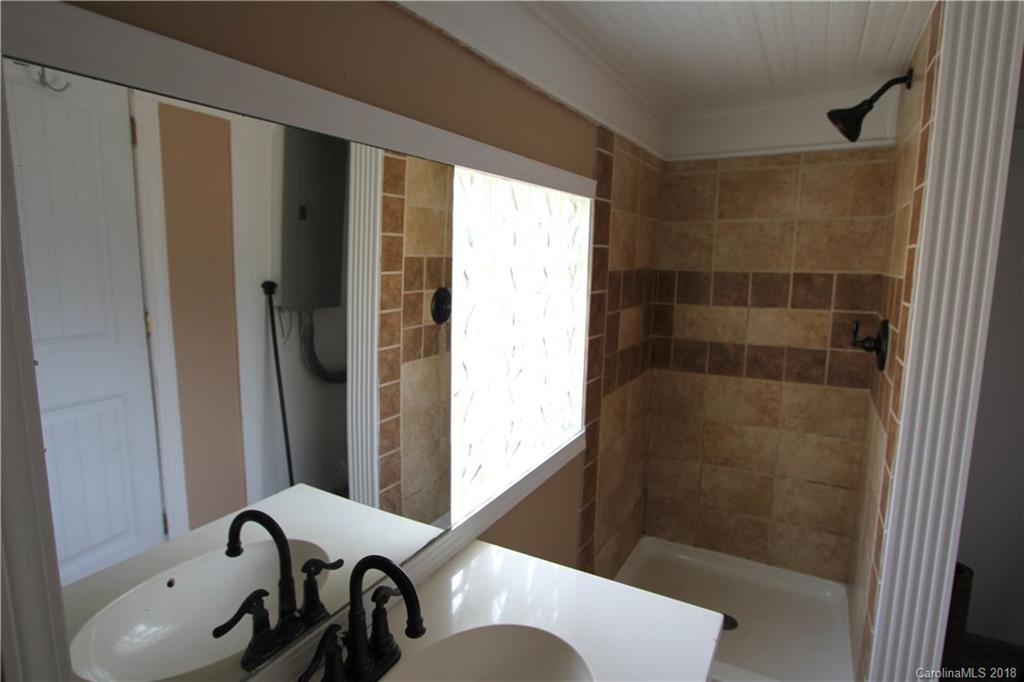 6616 Charlie Walker Road Kannapolis, NC 28081 - Photo 14 of 16 a bathroom with a bathtub and shower