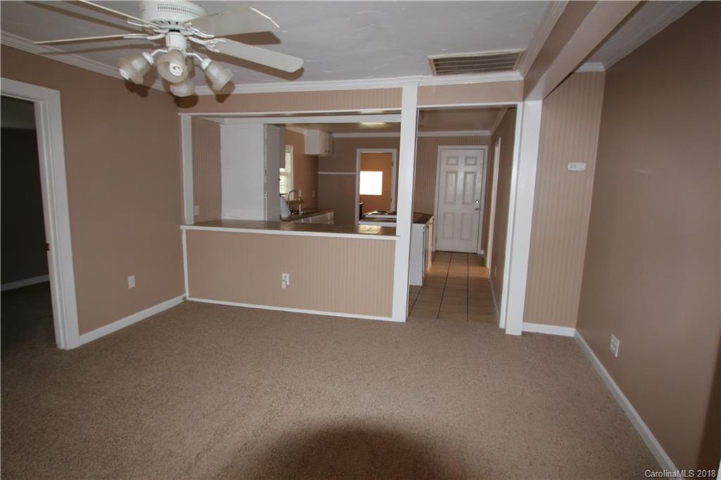6616 Charlie Walker Road Kannapolis, NC 28081 - Photo 5 of 16 wooden floor and chandelier in a room