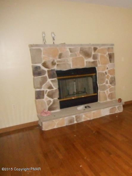 258 Lehman Road Bushkill, PA 18324 - Photo 3 of 8 a view of a fireplace with wooden floor