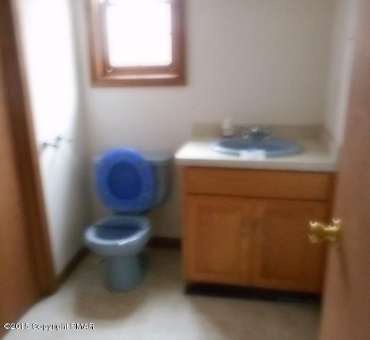 258 Lehman Road Bushkill, PA 18324 - Photo 5 of 8 a bathroom with a toilet and a sink