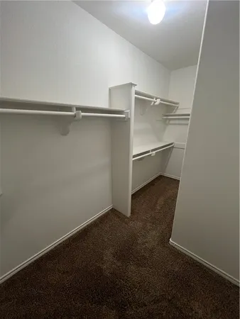 a view of an empty walk in closet