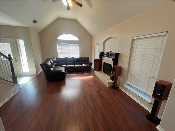 a living room with furniture and a fireplace