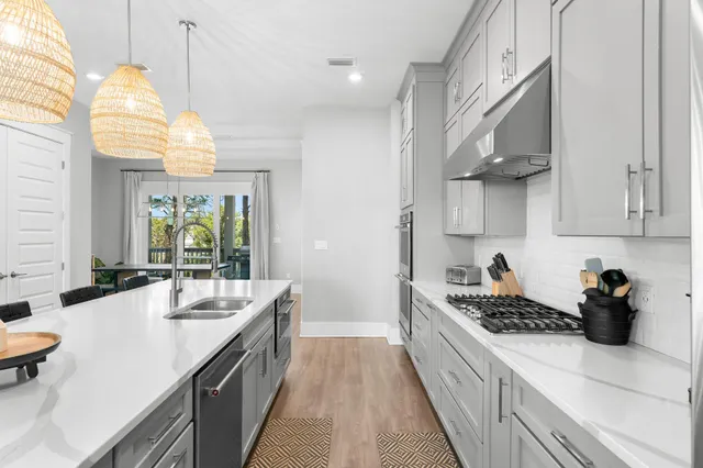 a view of a two chairs and table in the balcony