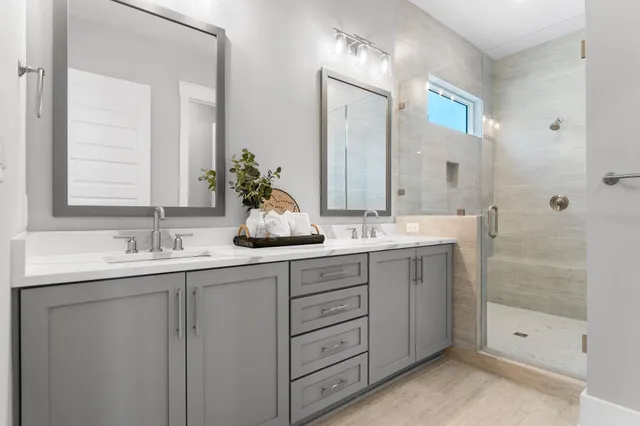 a living room with furniture and large windows