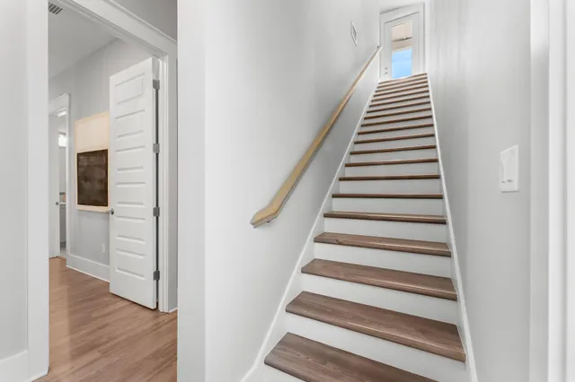 a view of a dining room with furniture and window