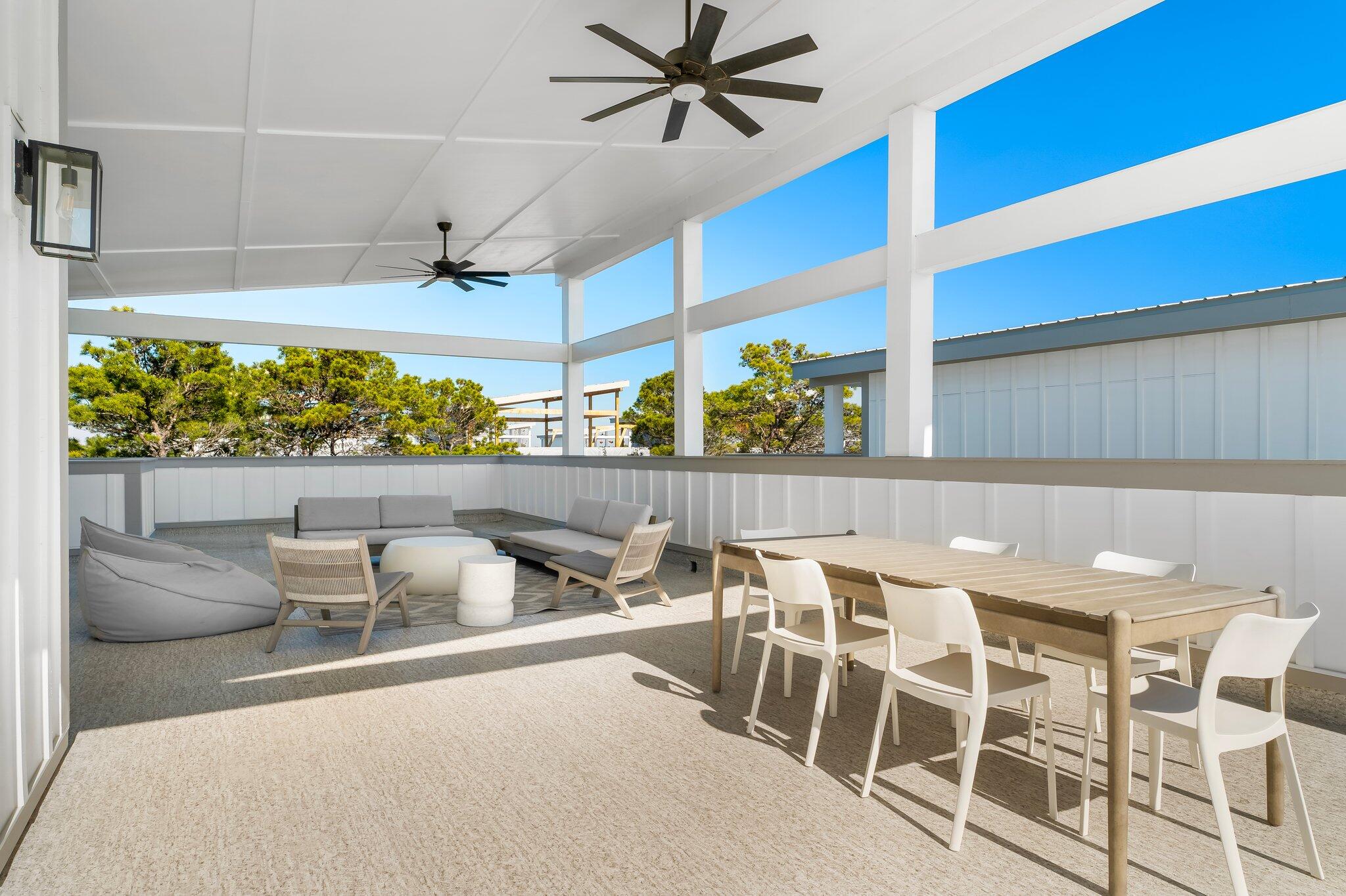 34 West Majestic Palm Dr Inlet Beach Inlet Beach, FL 32461 - Photo 49 of 71 a dining room with furniture and a floor to ceiling window