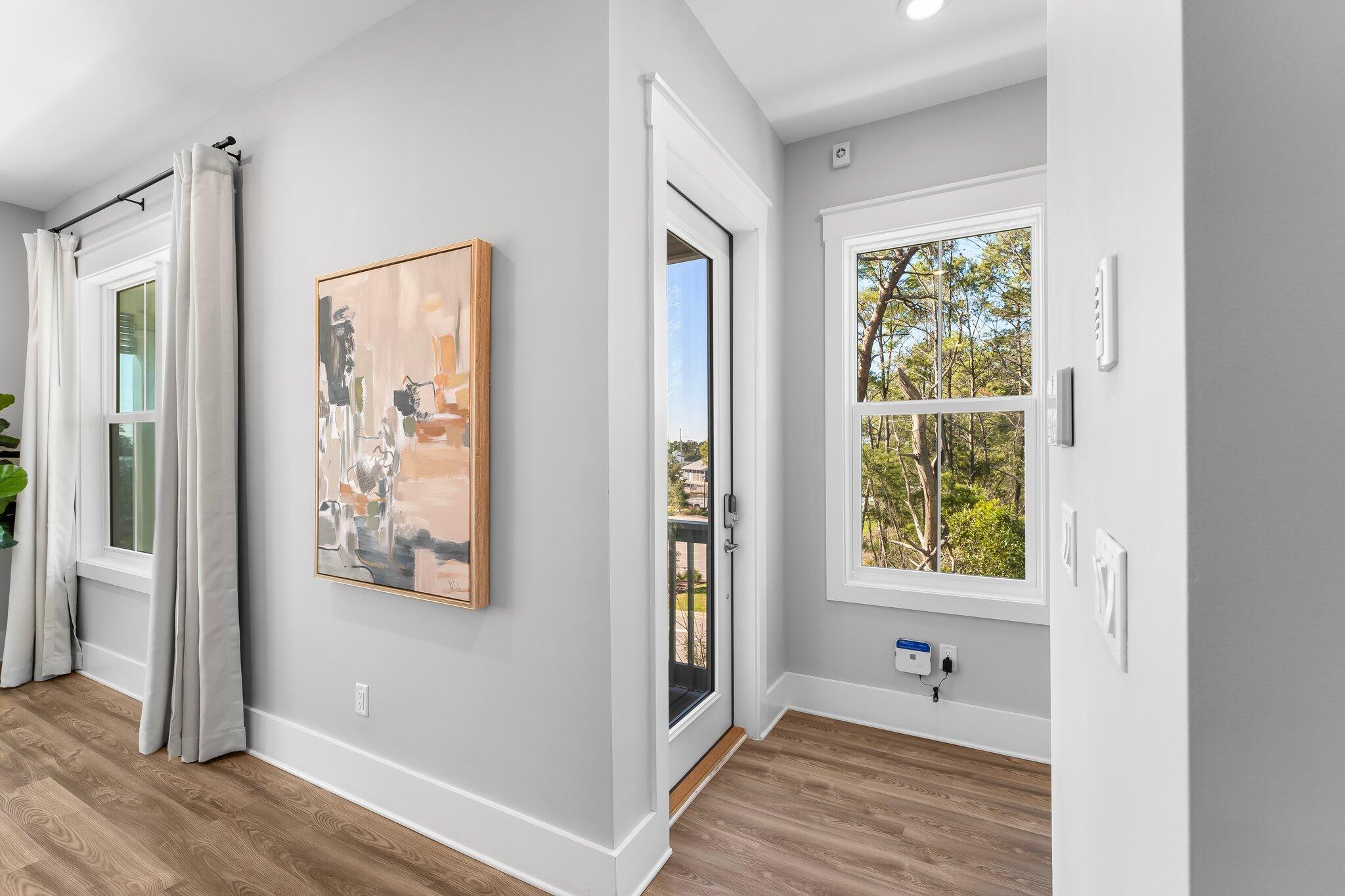 34 West Majestic Palm Dr Inlet Beach Inlet Beach, FL 32461 - Photo 5 of 71 a view of a hallway with wooden floor and a bathroom