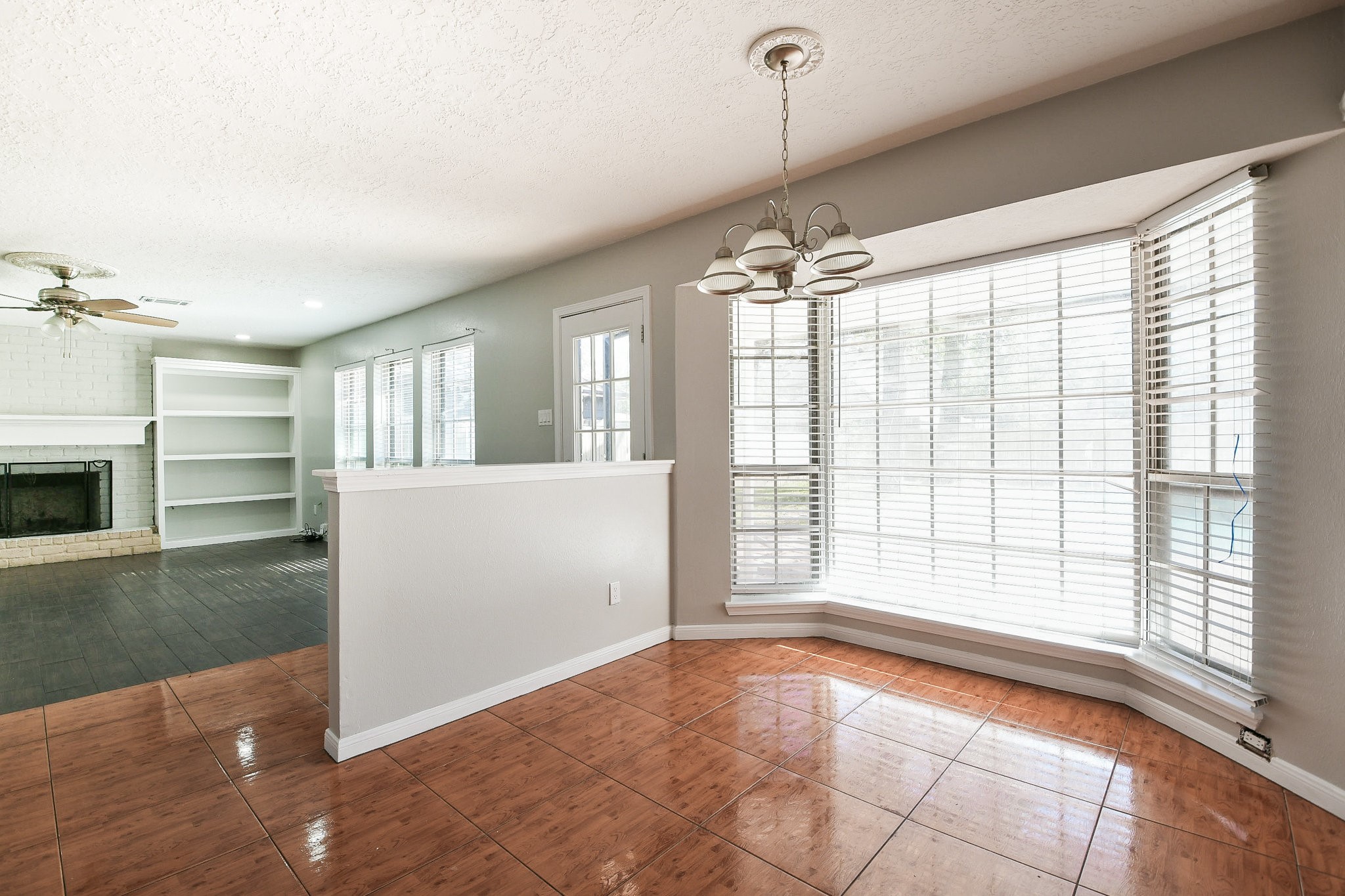 1007 Maranon Lane Houston, TX 77090 - Photo 12 of 36 a view of an empty room with a window and fire place