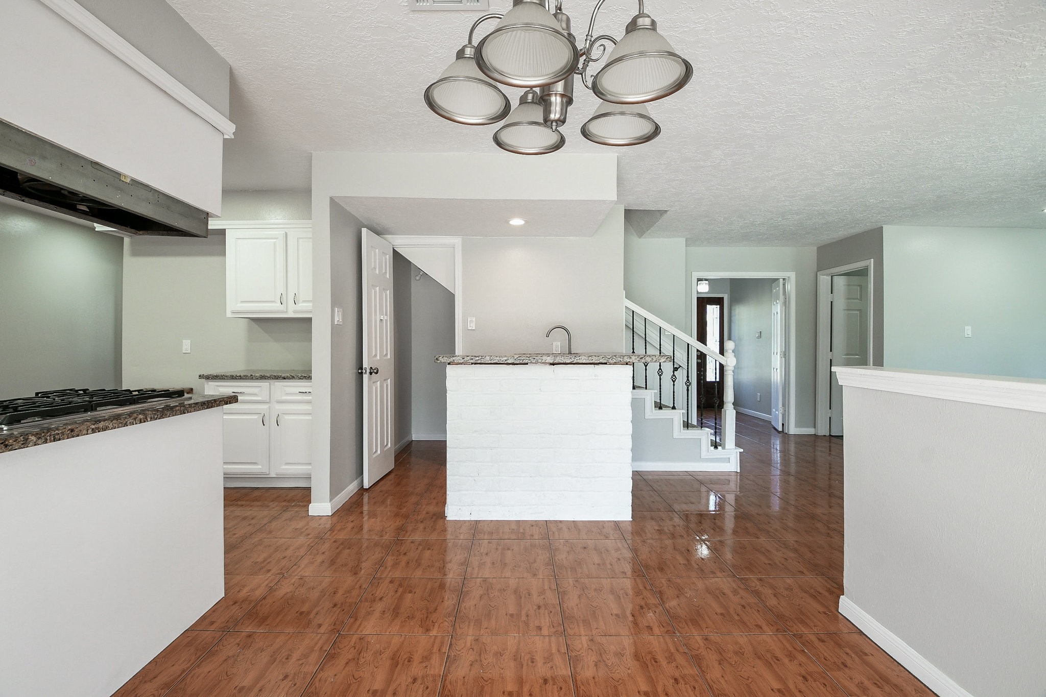 1007 Maranon Lane Houston, TX 77090 - Photo 17 of 36 a kitchen with a refrigerator and a stove top oven