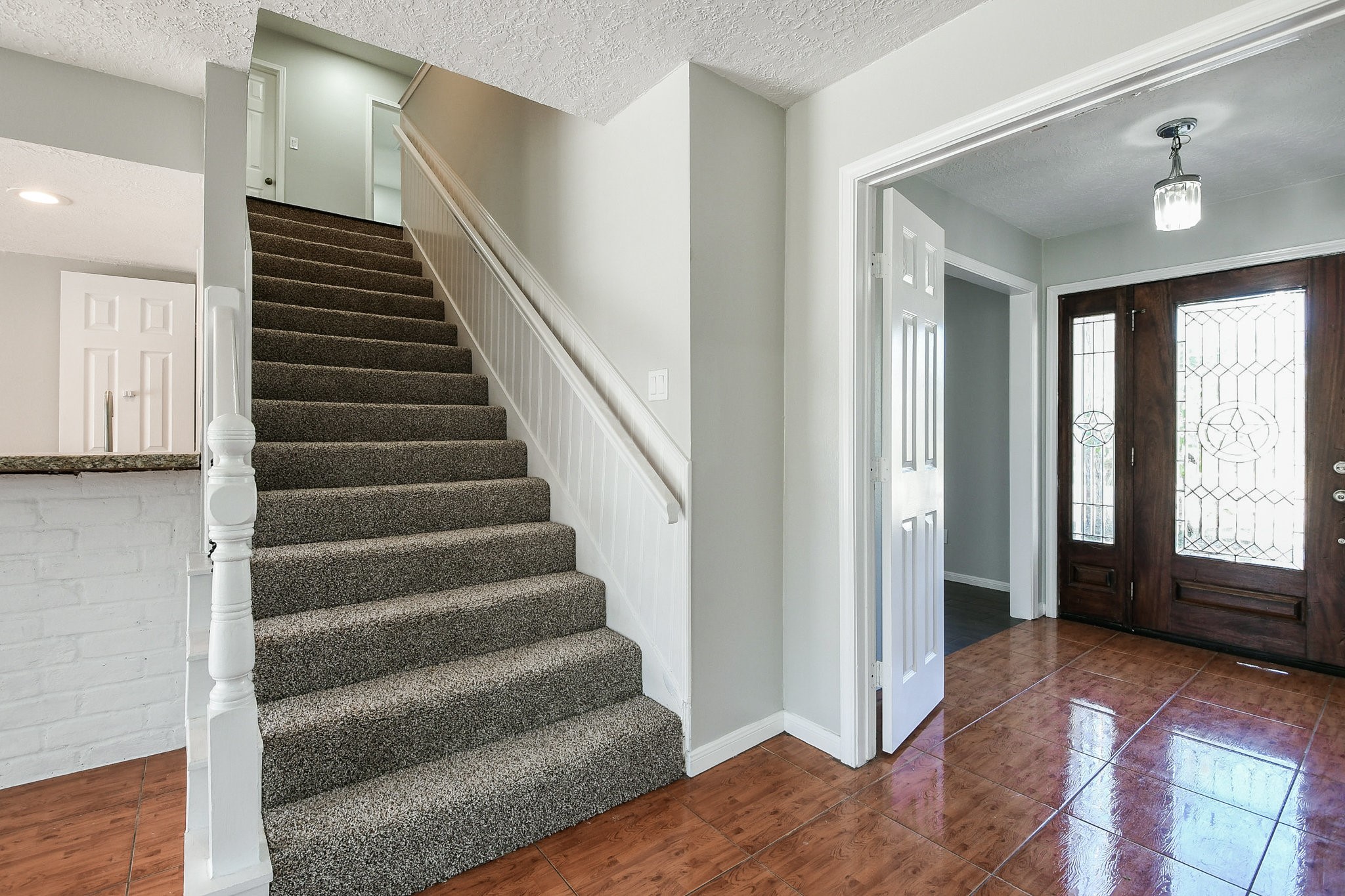 1007 Maranon Lane Houston, TX 77090 - Photo 4 of 36 a view of entryway with wooden floor and stairs