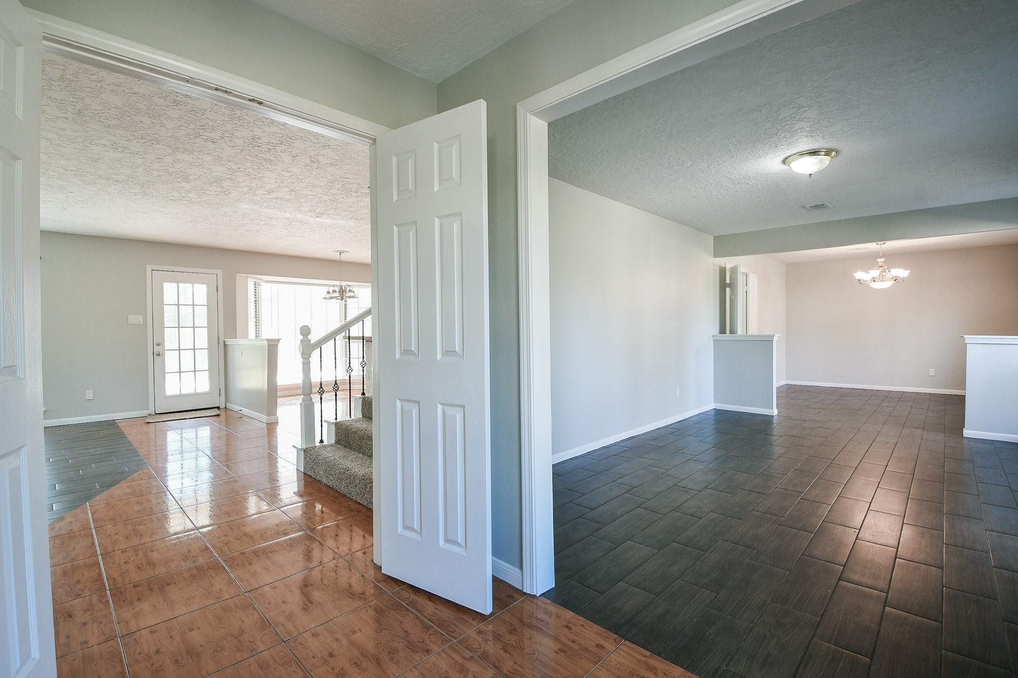 1007 Maranon Lane Houston, TX 77090 - Photo 5 of 36 a view of a hallway with wooden floor and windows
