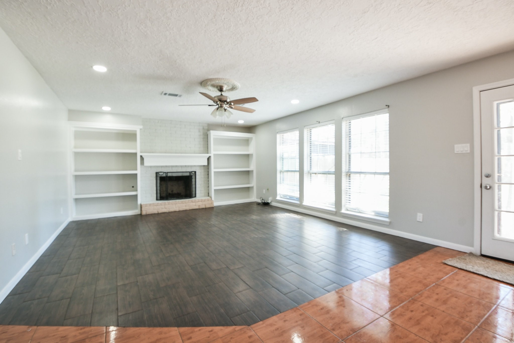 1007 Maranon Lane Houston, TX 77090 - Photo 9 of 36 a view of an empty room with a window and fireplace