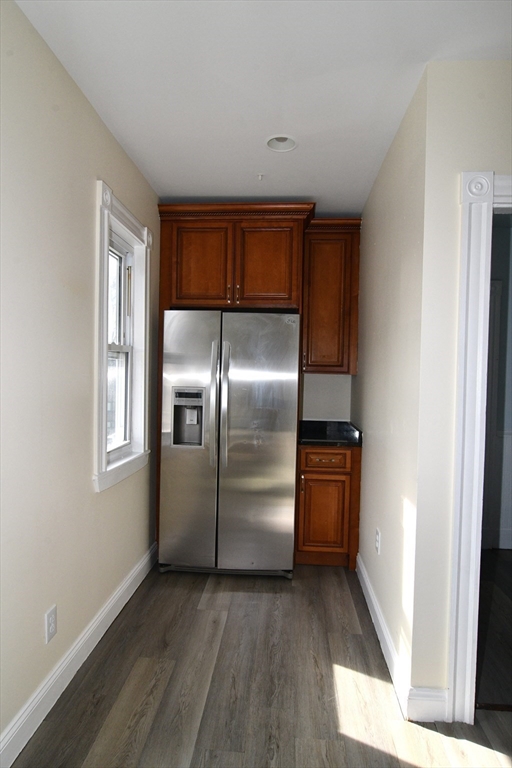 121 Cottage Street Everett, MA 02149 - Photo 19 of 35 a kitchen with a refrigerator a sink and dishwasher