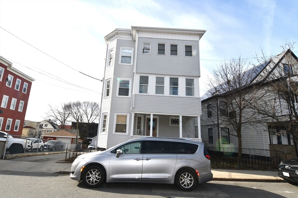 121 Cottage Street Everett, MA 02149 - Photo 2 of 35 a car parked in front of a house