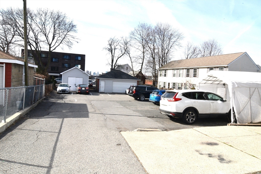 121 Cottage Street Everett, MA 02149 - Photo 7 of 35 a view of street with parked cars