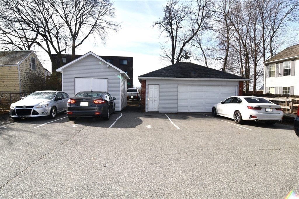 121 Cottage Street Everett, MA 02149 - Photo 8 of 35 a car parked in front of a house