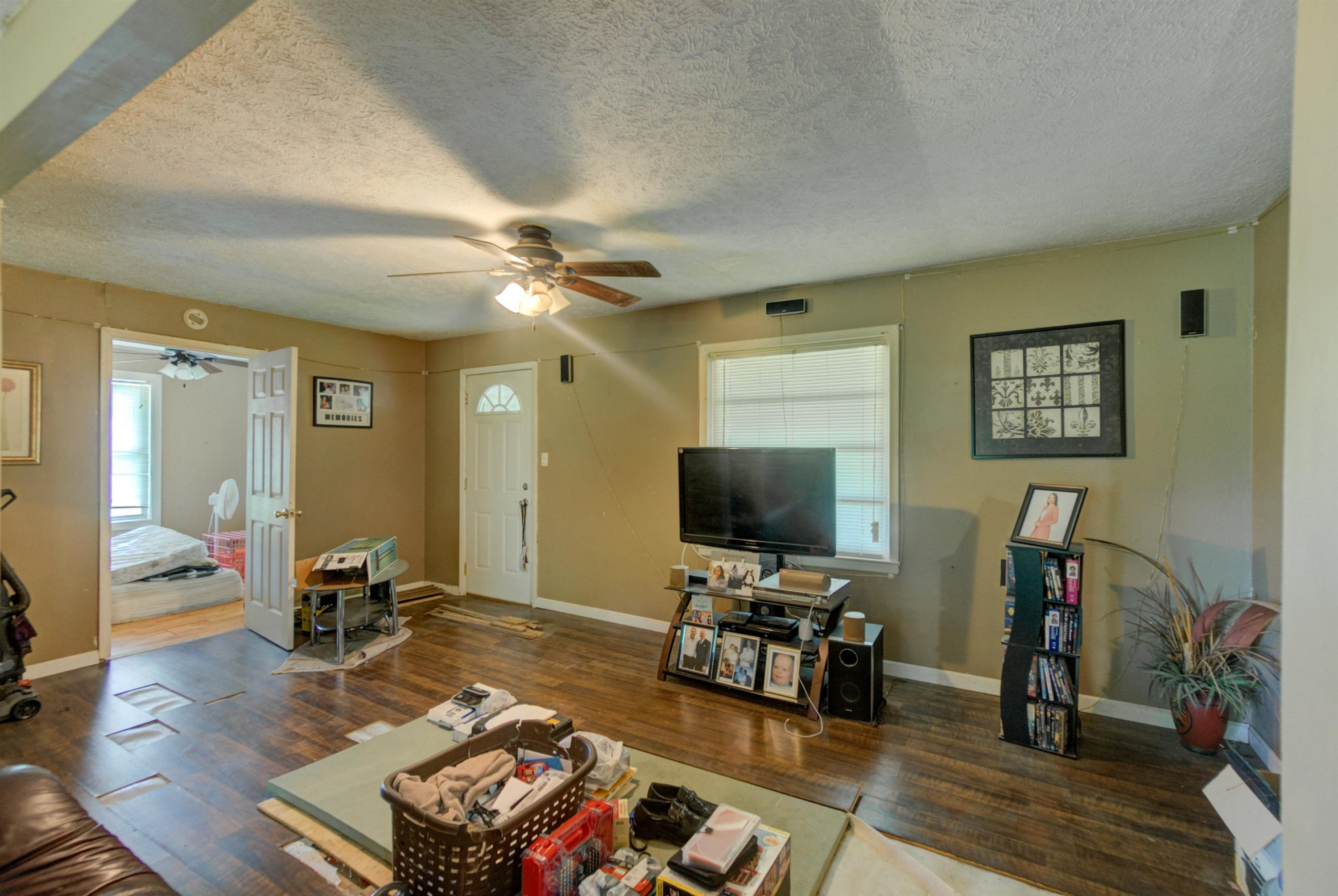 4066 Beech Bluff Road Beech Bluff, TN 38313 - Photo 6 of 14 a living room with furniture and a flat screen tv