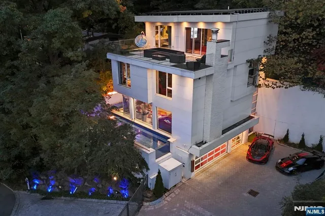 an aerial view of a house with yard