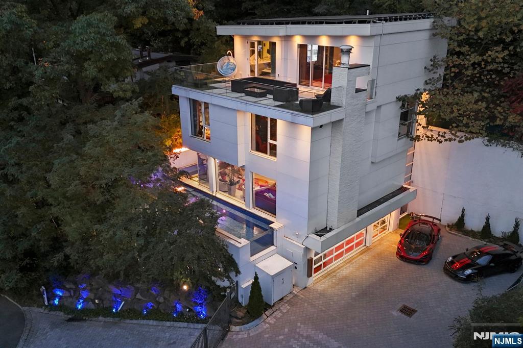 an aerial view of a house with yard