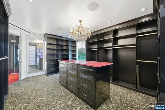 a bathroom with a double vanity sink mirror and shower