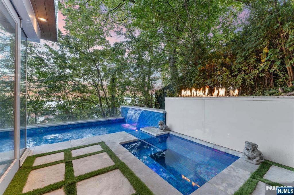 31 A Casta Lane Edgewater, NJ 07020 - Photo 17 of 21 a view of a backyard with sitting area