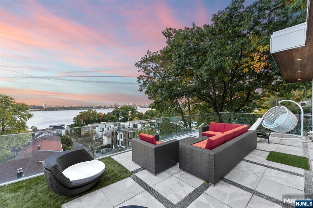 31 A Casta Lane Edgewater, NJ 07020 - Photo 2 of 21 a view of a patio with couches chairs and a potted plant