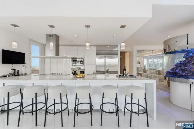 a kitchen with kitchen island granite countertop a table and chairs