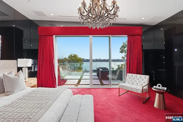 a living room with furniture a rug and a table