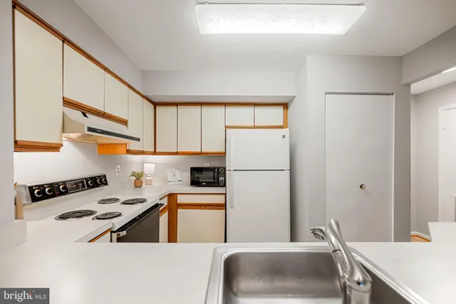 a kitchen with a sink and a window