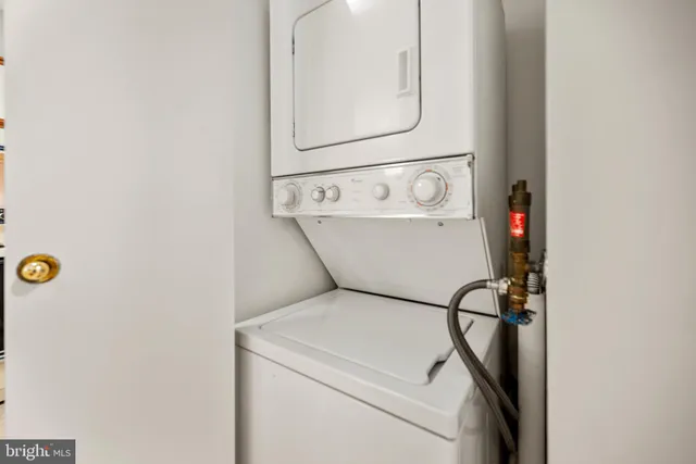 a kitchen with stainless steel appliances a stove a sink and a refrigerator