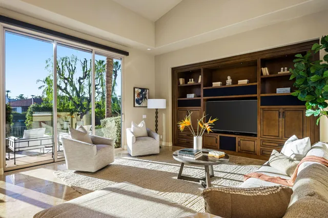 a view of a chairs and table in patio