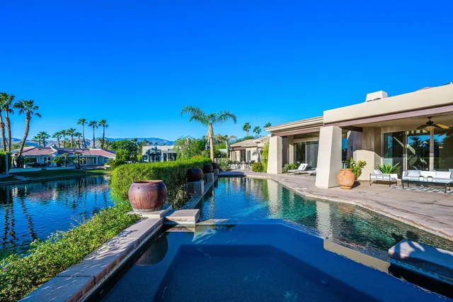 a large kitchen with stainless steel appliances granite countertop plenty of counter top and sink