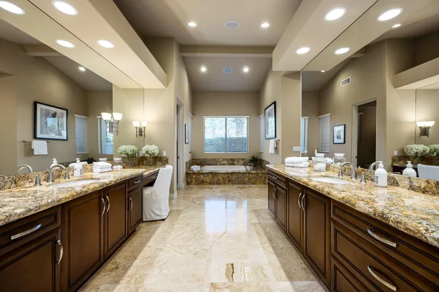 a view of a patio with table and chairs and potted plants