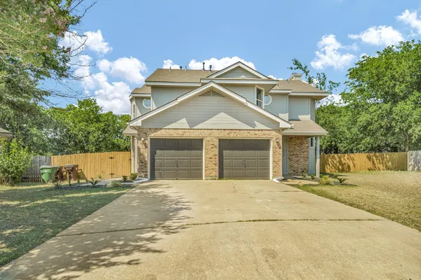 a front view of a house with a garage